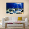 Multiple eletric lightning strikes over river Multi Panel Canvas Wall Art