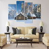 Old houses in snowy forest Multi panel canvas wall art