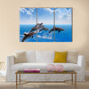 Jumping Dolphins, Blue Sea And Sky, White Clouds Multi Panel Canvas Wall Art