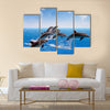 Jumping Dolphins, Blue Sea And Sky, White Clouds Multi Panel Canvas Wall Art