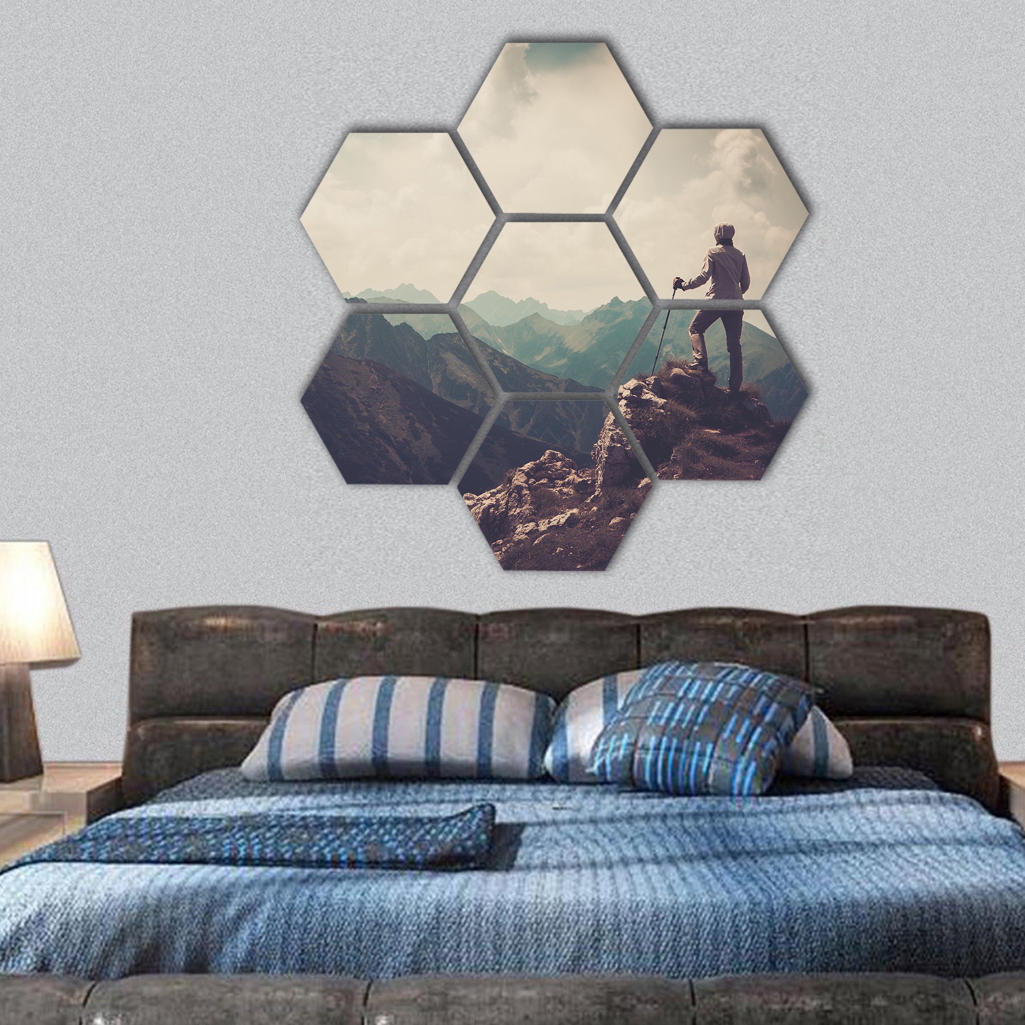Woman hiker on a top of a mountain hexagonal canvas wall art