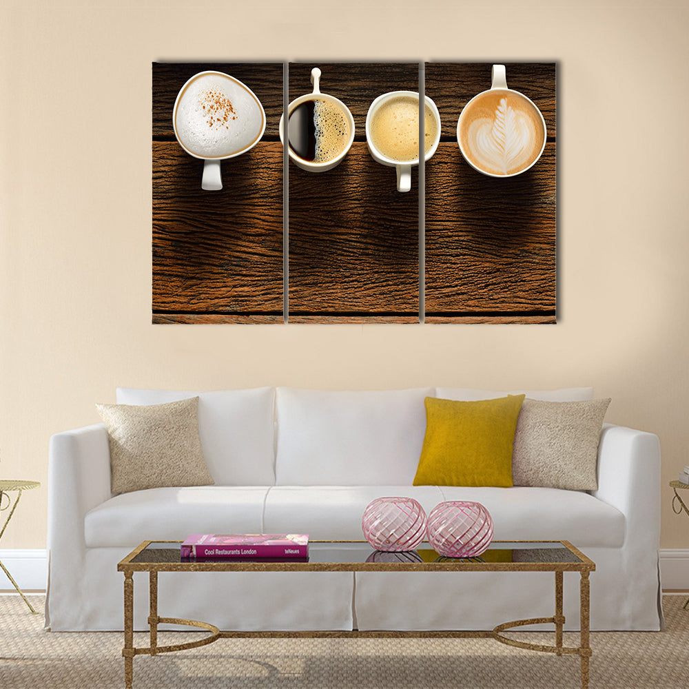 Variety of cups of coffee on old wooden table Multi Panel Canvas Wall Art