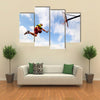 Young man jumping and playing street ball basketball Urban authentic Multi panel canvas wall art