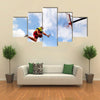 Young man jumping and playing street ball basketball Urban authentic Multi panel canvas wall art