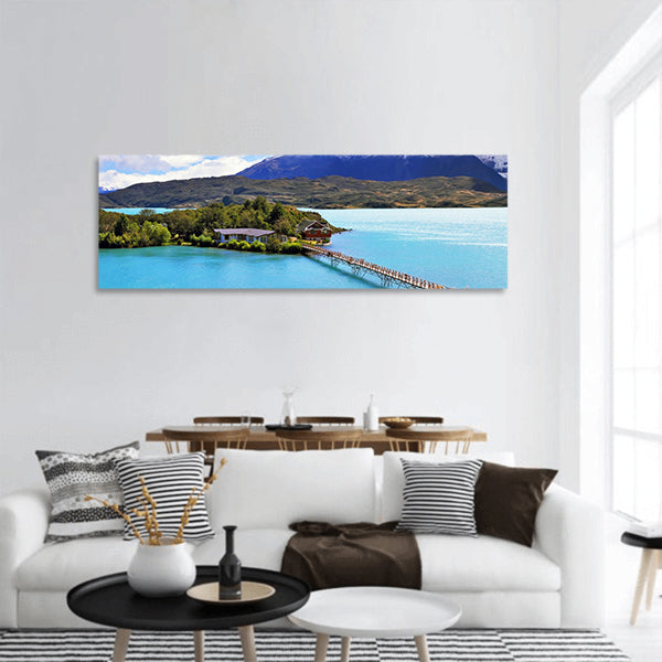 Island in lake Pehoe lake clouds cover cliffs of Los Kuernos panoramic canvas wall art