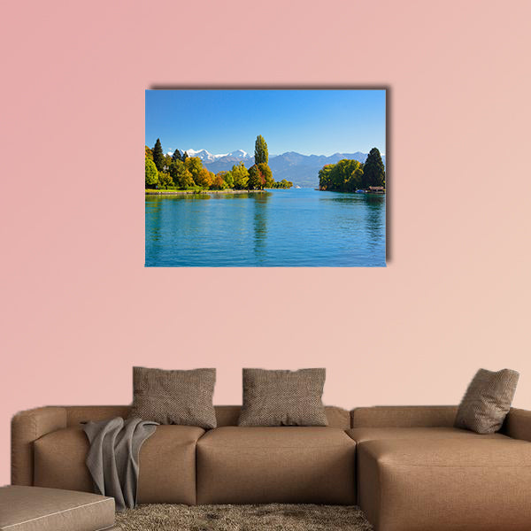 Lake Thun with Jungfrau Mountain in autumn on clear blue sky, Switzerland, Shot using CPL filter Multi panel canvas wall art