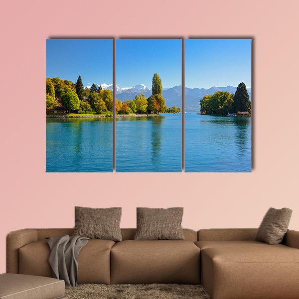 Lake Thun with Jungfrau Mountain in autumn on clear blue sky, Switzerland, Shot using CPL filter Multi panel canvas wall art