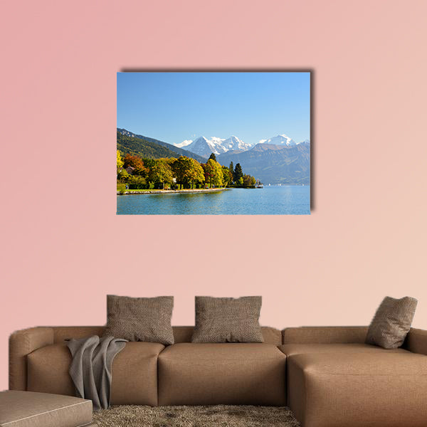 Lake Thun with Jungfrau Mountain in autumn on clear blue sky multi panel canvas wall art
