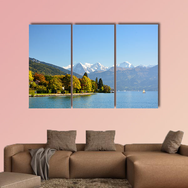 Lake Thun with Jungfrau Mountain in autumn on clear blue sky multi panel canvas wall art