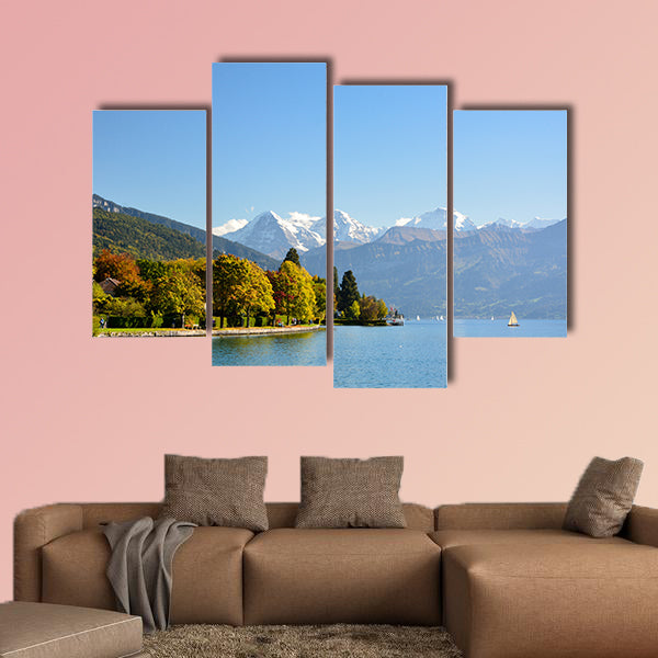 Lake Thun with Jungfrau Mountain in autumn on clear blue sky multi panel canvas wall art