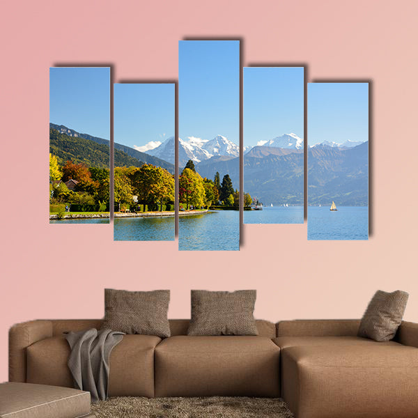 Lake Thun with Jungfrau Mountain in autumn on clear blue sky multi panel canvas wall art