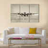 World War II era heavy bomber front view stained old photo Multi Panel Canvas Wall Art