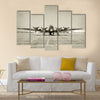 World War II era heavy bomber front view stained old photo Multi Panel Canvas Wall Art