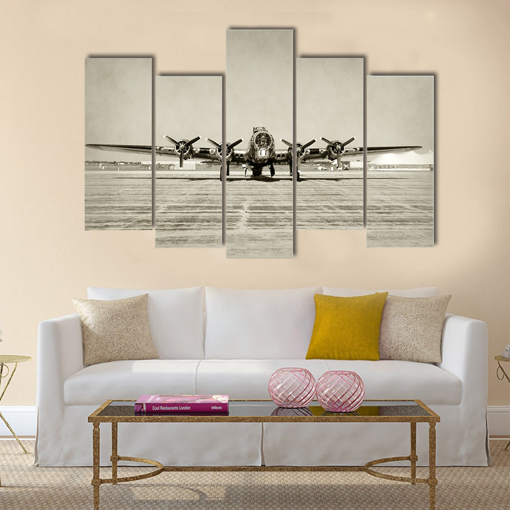 World War II era heavy bomber front view stained old photo Multi Panel Canvas Wall Art