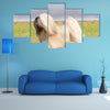 A small young light tan, fawn, beige, gray and white Lhasa Apso dog Multi Panel Canvas Wall Art