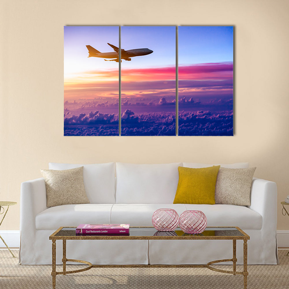 Airplane in the sky at sunrise multi panel canvas wall art