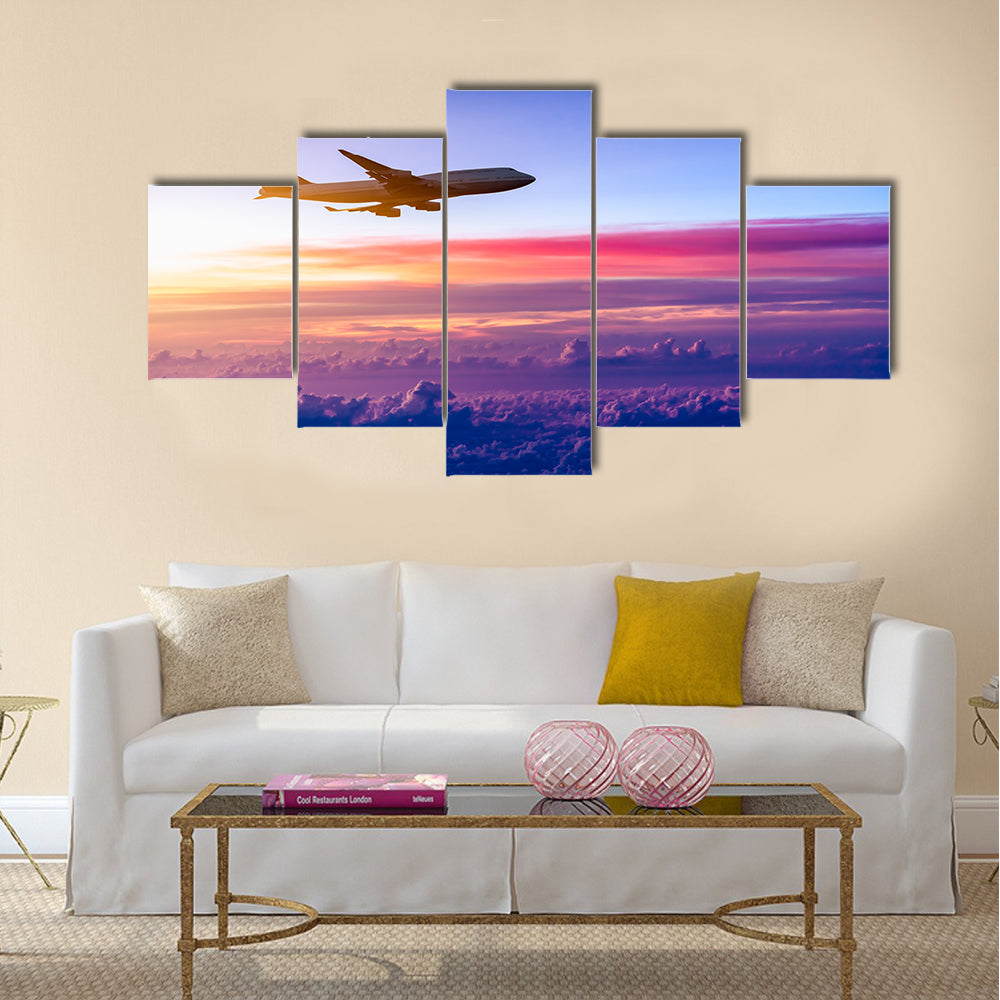 Airplane in the sky at sunrise multi panel canvas wall art