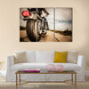 Biker girl riding on a motorcycle Bottom view of the legs in leather boots Multi panel canvas wall art