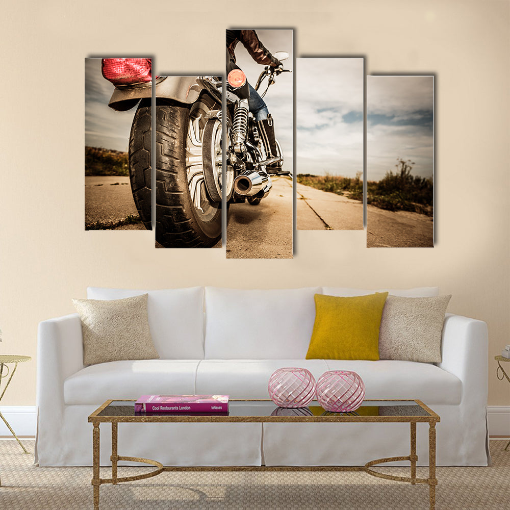 Biker girl riding on a motorcycle Bottom view of the legs in leather boots Multi panel canvas wall art