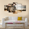 Biker girl riding on a motorcycle Bottom view of the legs in leather boots Multi panel canvas wall art