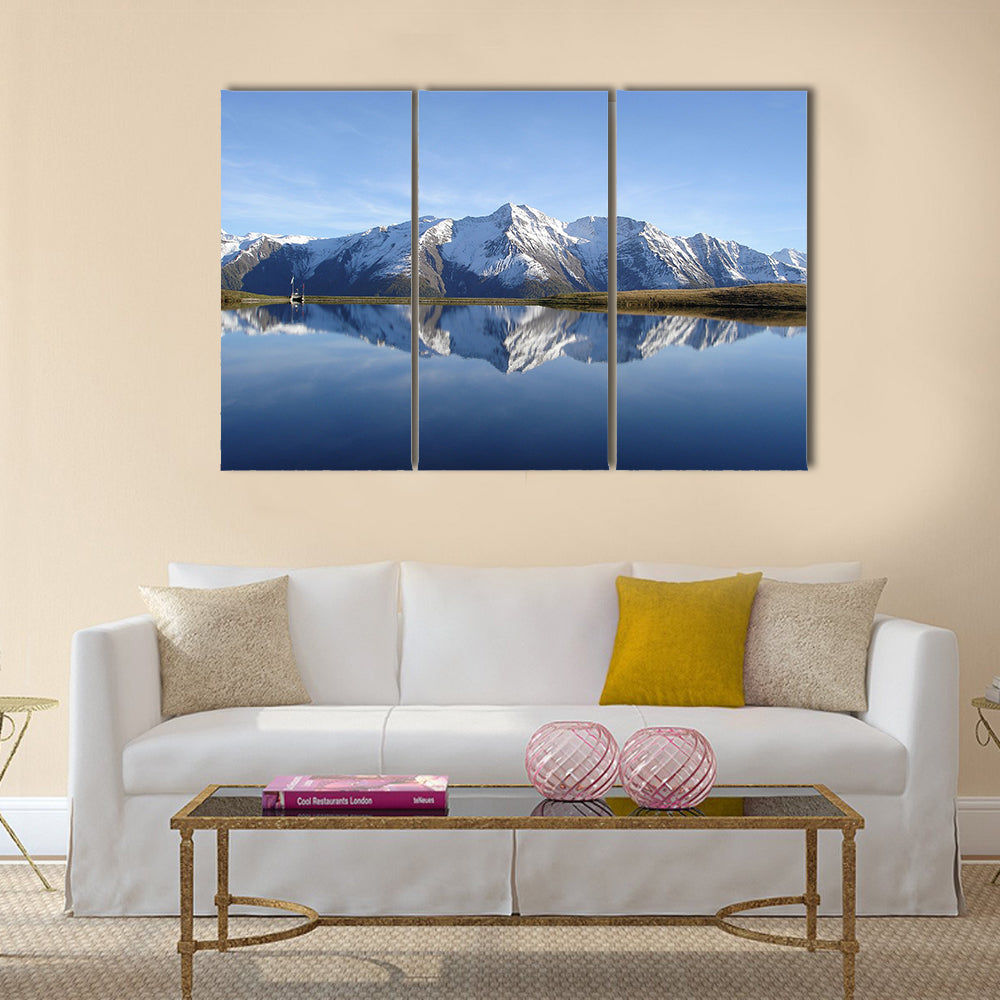 Reflection in the water of the quiet and beautiful Bettmersee Lake Multi panel canvas wall art