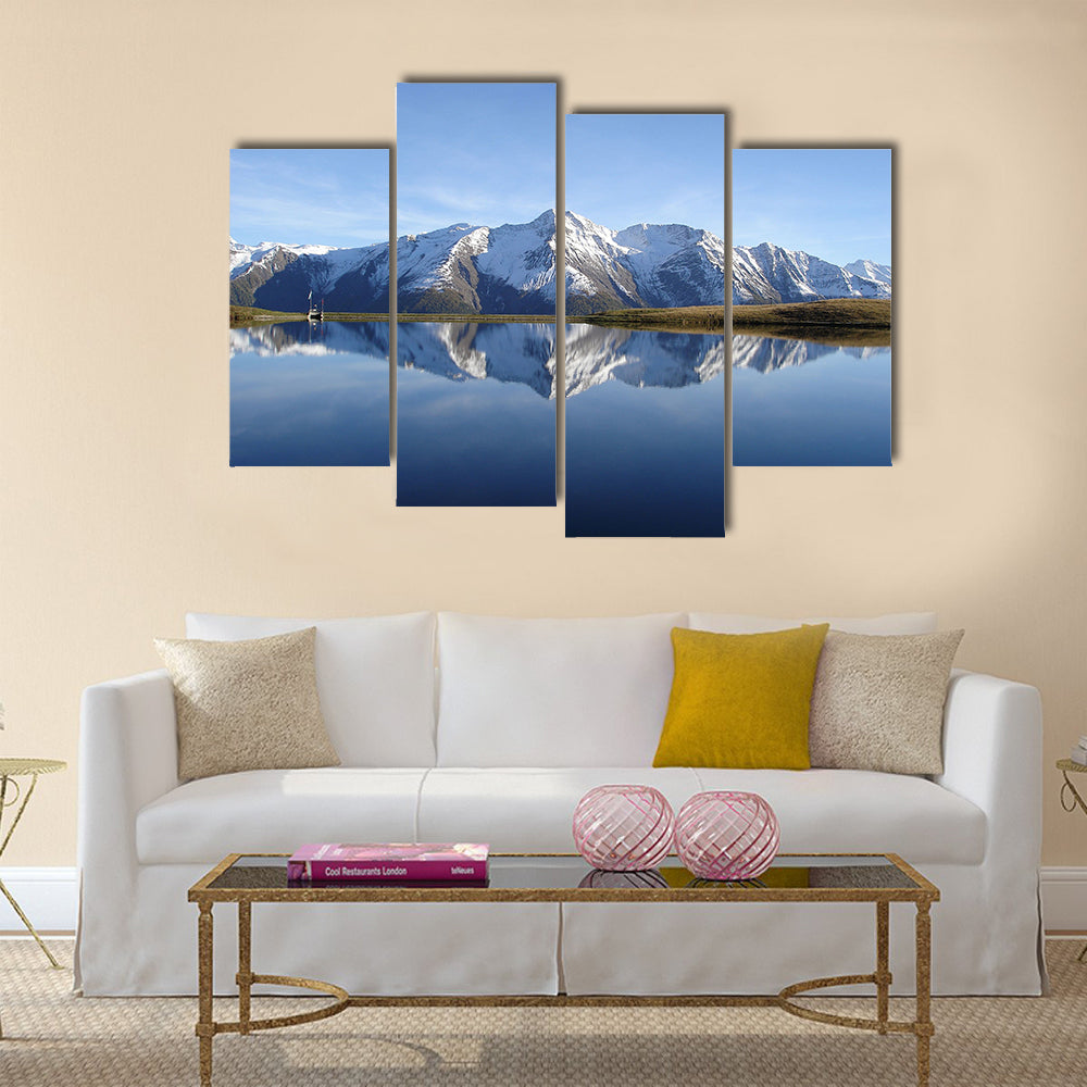 Reflection in the water of the quiet and beautiful Bettmersee Lake Multi panel canvas wall art