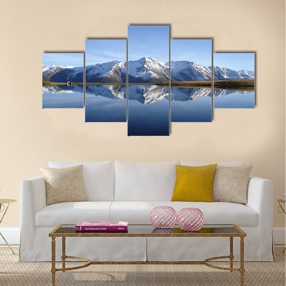 Reflection in the water of the quiet and beautiful Bettmersee Lake Multi panel canvas wall art