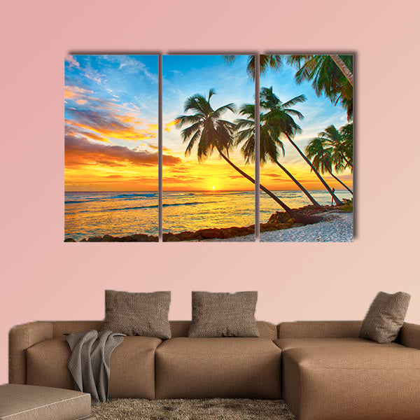 Beautiful sunset over the sea with a view at palms wall art