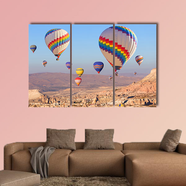 Balloons flying over rock landscape multi panel canvas wall art