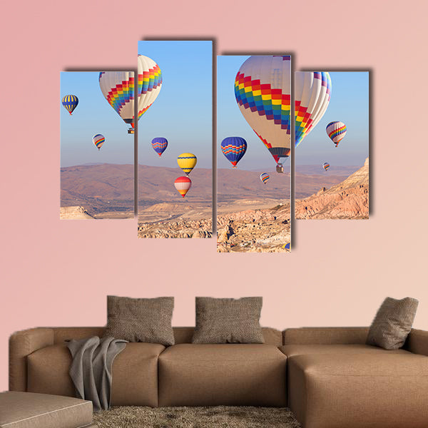 Balloons flying over rock landscape multi panel canvas wall art