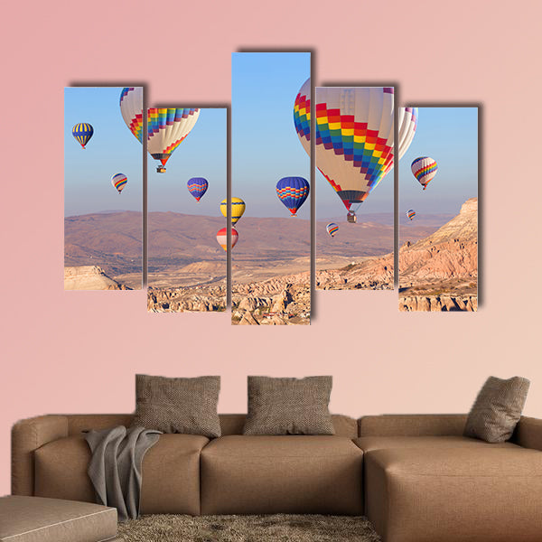 Balloons flying over rock landscape multi panel canvas wall art