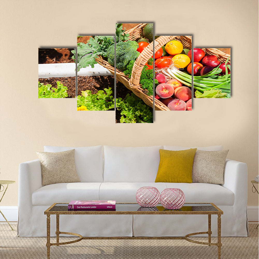 Basket of fresh organic fruit and vegetables in garden Multi panel canvas wall art