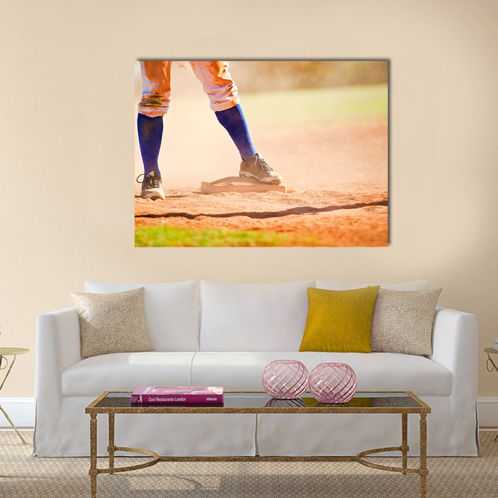 Baseball player wearing blue socks standing on a baseball base Multi panel canvas wall art