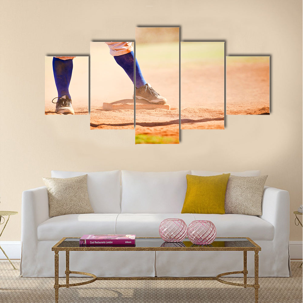 Baseball player wearing blue socks standing on a baseball base Multi panel canvas wall art