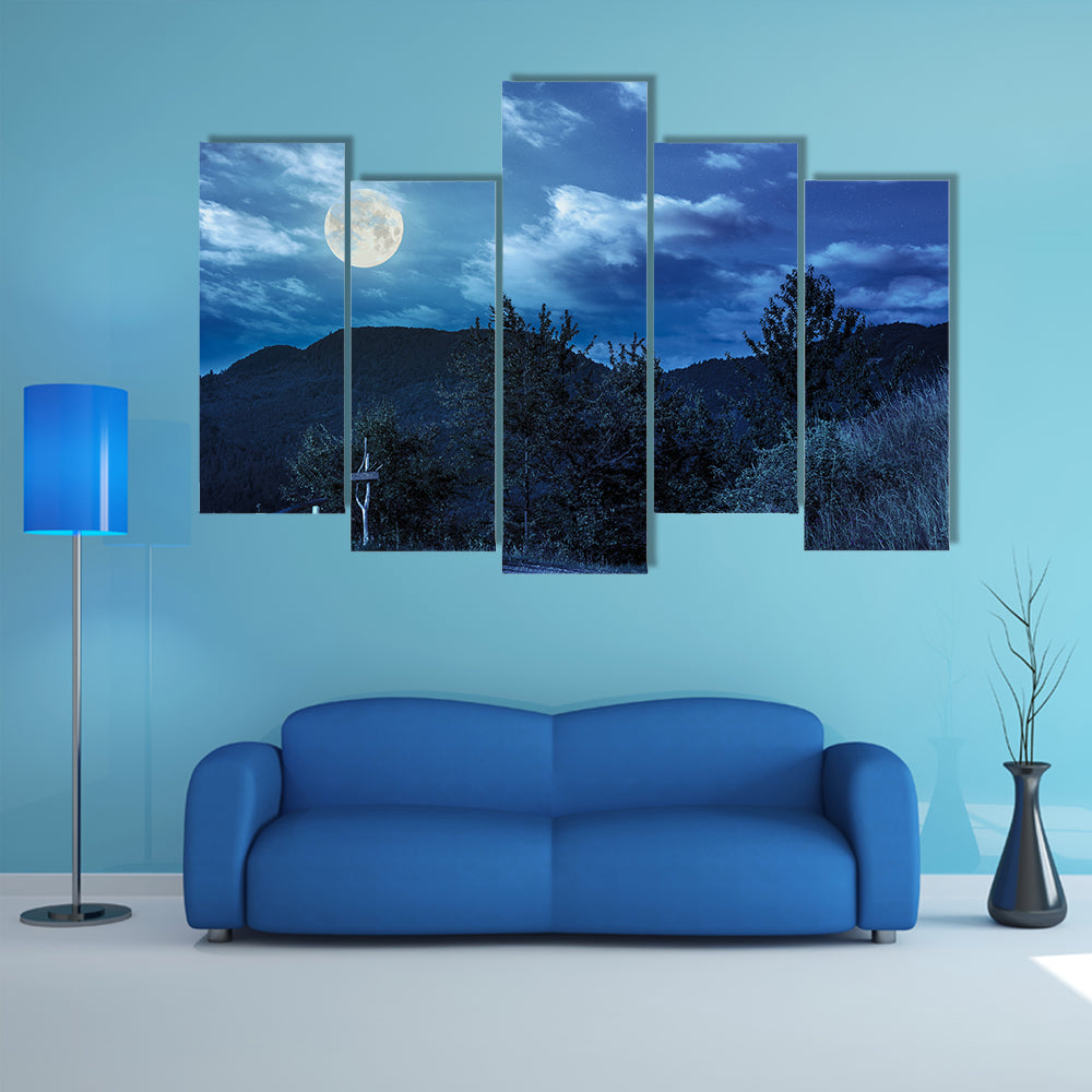 Summer landscape With A Fence Near The Path On The Hillside In High Mountain At Night In Full Moon Multi Panel Canvas Wall Art