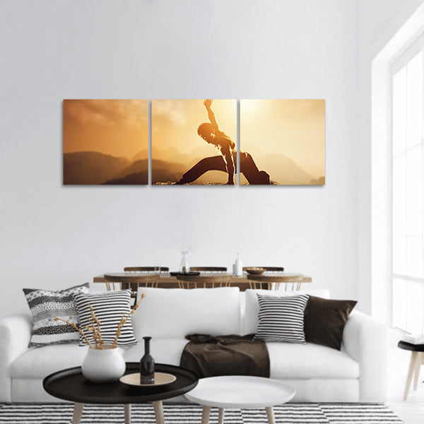 Asian man, fighter practices martial arts in mountains at sunset panoramic canvas wall art