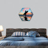 Young surfer with board on the beach hexagonal canvas wall art