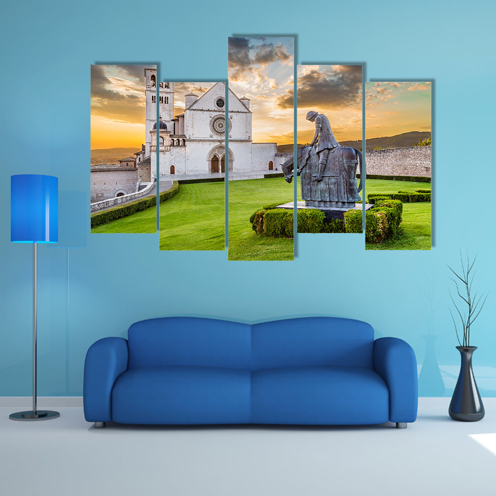 Famous Basilica of St Francis of Assisi with statue at sunset in Assisi, Umbria, Italy multi panel canvas wall art