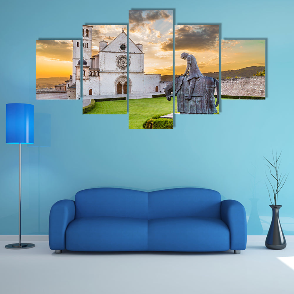 Famous Basilica of St Francis of Assisi with statue at sunset in Assisi, Umbria, Italy multi panel canvas wall art