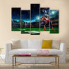 American football player in action on the stadium Multi panel canvas wall art