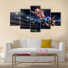 Strong American football player in action on the stadium Multi panel canvas wall art