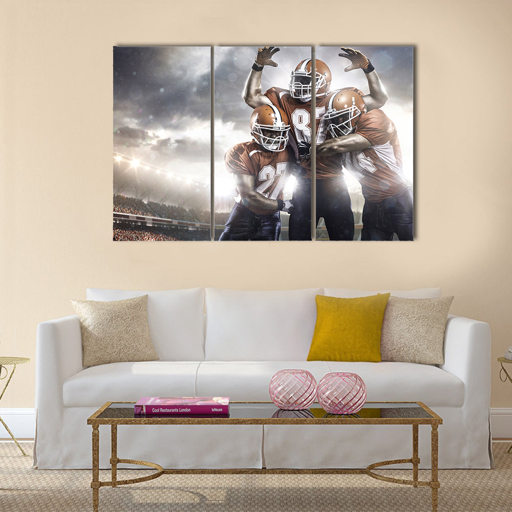 Three American football player in action on the stadium Multi panel canvas wall art