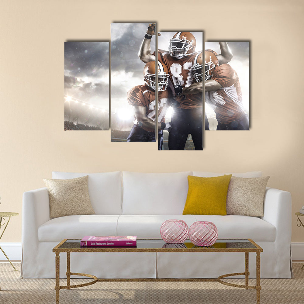 Three American football player in action on the stadium Multi panel canvas wall art