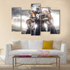 Three American football player in action on the stadium Multi panel canvas wall art