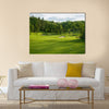 A golf green with bunkers with backdrop of trees Multi Panel Canvas Wall Art