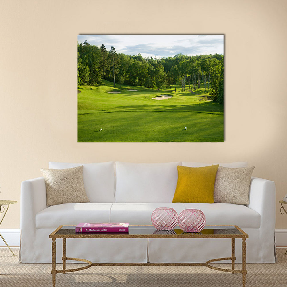 A golf green with bunkers with backdrop of trees Multi Panel Canvas Wall Art