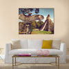 Neophron looking at the ancient ruins of the Mayan city of Tikal Central America, Guatemala Multi panel canvas wall art