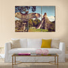 Neophron looking at the ancient ruins of the Mayan city of Tikal Central America, Guatemala Multi panel canvas wall art