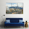 Cars passing in a highway of Tehran with Milad Tower and Alborz Mountains in the background Multi Panel Canvas Wall Art