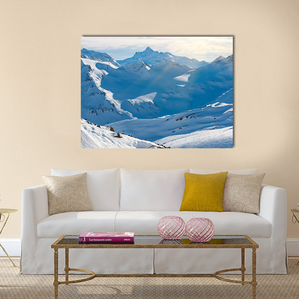 Snowy blue mountains in clouds Multi panel canvas wall art